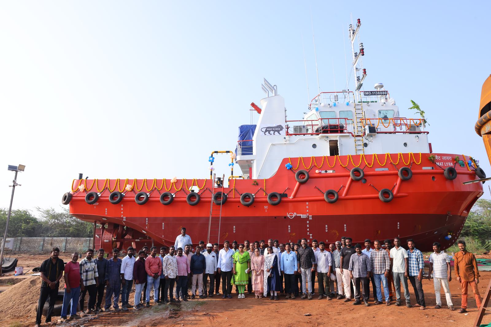 The Bluebay team in front of a newly built tug